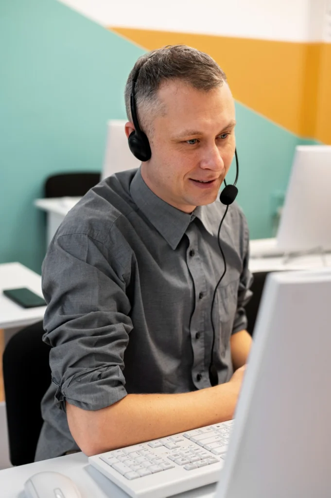 man-wearing-headset-at-desk