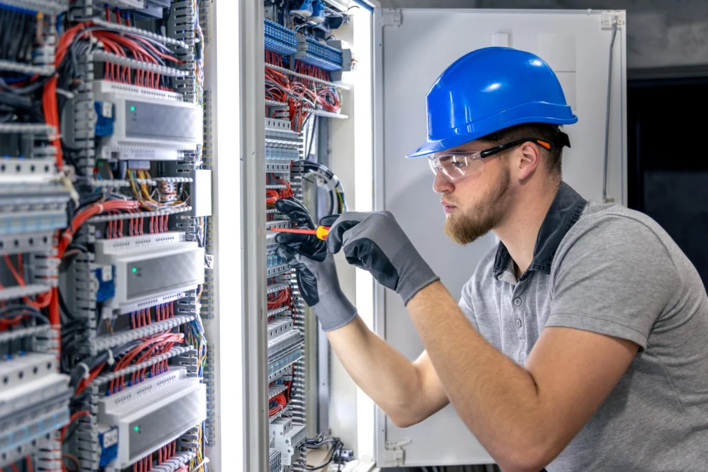 A man is doing a Cat6 vs Cat6A network cabling work for business office infrastructure